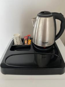 a tea kettle sitting on top of a stove at Ferah Otel in Istanbul