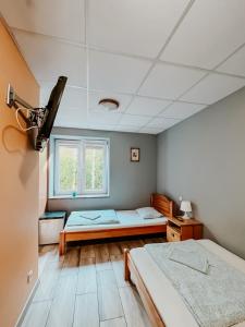 Posteľ alebo postele v izbe v ubytovaní Hostel Filip