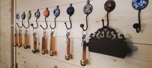 a wall with a bunch of baseball bats and a sign at L'Auberge d'Eygliers in Eygliers +34 photos