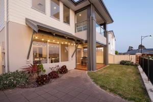 a house with a porch with lights on it at The Lookout in Dunsborough