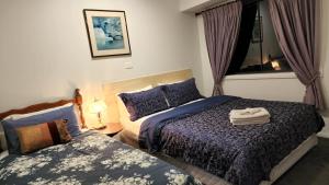 Giường trong phòng chung tại Gowrie Agapanthus