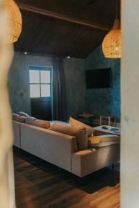 a living room with a couch and a television at Runa Farm in Barnard Castle