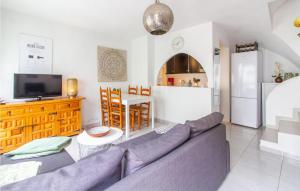 a living room with a couch and a kitchen at 3 Bedroom Gorgeous Home In El Campello in El Campello