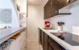 a kitchen with white cabinets and a sink at 3 Bedroom Gorgeous Home In El Campello in El Campello