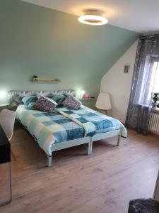 En eller flere senge i et værelse på Vakantieappartement Achat Duitsland