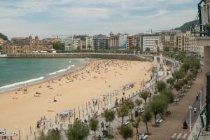 a view of a beach with people on it at Hotel Niza in Donostia-San Sebastián