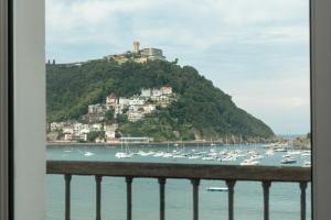 a view of a harbor with boats in the water at Hotel Niza in Donostia-San Sebastián