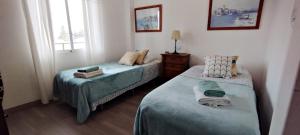 A bed or beds in a room at AP341 - Capri