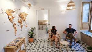 a group of people sitting in a room at Veranera Hostel in Estepona