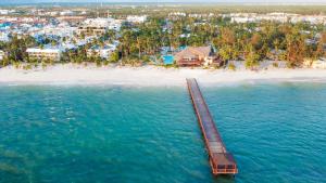 an aerial view of a beach with a pier at Impressive Punta Cana - All Inclusive in Punta Cana