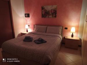 Een bed of bedden in een kamer bij AI NIPOTI