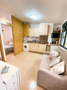 A kitchen or kitchenette at Apartamentos Sapoconcho by ALÔGA