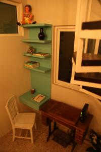a room with a desk and a chair and a window at Casa RM26 CoLiving & Travel Roma Norte, CDMX in Mexico City
