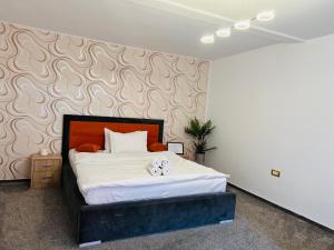 Postel nebo postele na pokoji v ubytování Orange House Constanta