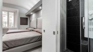 A bed or beds in a room at Scipioni Best Rooms