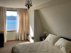 En eller flere senger på et rom på Cabañas Posada Alemana