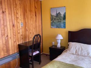 En eller flere senger på et rom på Cabañas Posada Alemana