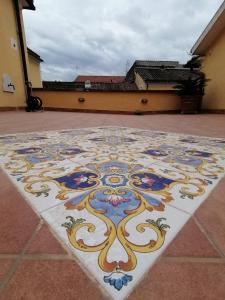 a colorful tile floor in front of a building at B&B Palazzo Lanza in Capua