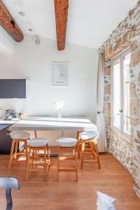 a kitchen and dining room with a table and chairs at Very Nice 58m Close To The Old Port in Marseille
