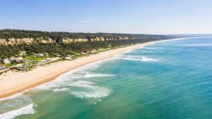 an aerial view of a beach with the ocean at Apartment Aroeira Golf II in Carcereiro