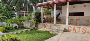 a house with a sign that reads cats jungle at Green Hill Mirissa in Mirissa