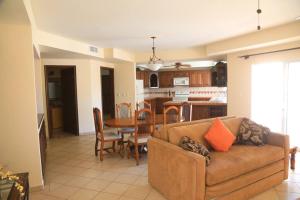 a living room with a couch and a table at Family House - The Village in Las Conchas #19 in Las Conchas