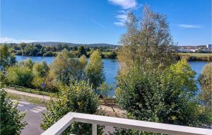 a view of a river with trees and a bench at Amazing Apartment In Triel-sur-seine With 2 Bedrooms And Wifi in Triel-sur-Seine