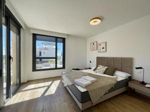 Ένα ή περισσότερα κρεβάτια σε δωμάτιο στο Allon Bay +27 φωτογραφίες