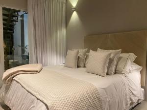 Postel nebo postele na pokoji v ubytování Lunalá Hotel Boutique