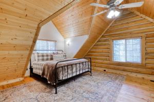 a bedroom with a bed in a room with wooden walls at Woodland Wonder in Brian Head