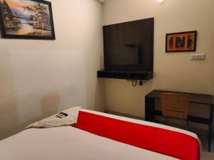 Ένα ή περισσότερα κρεβάτια σε δωμάτιο στο Pristine Inn Manyata