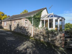 an old stone building with a gazebo on it at The Wagon House in Launceston