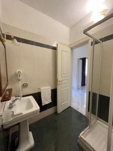 a bathroom with a sink and a shower at Villa Edelweiss in Bacoli +59 photos