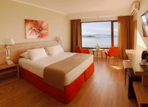 Cama ou camas em um quarto em Xelena Hotel & Suites