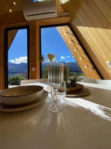 a wine glass sitting on top of a table at Roots Svaneti ' რუთს სვანეთი in Lentekhi +32 photos