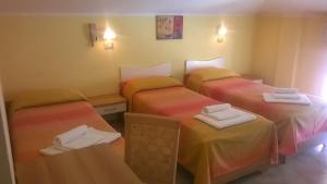 Ένα ή περισσότερα κρεβάτια σε δωμάτιο στο Hotel Carmen Viserba +64 φωτογραφίες