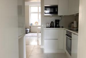 Kuchyň nebo kuchyňský kout v ubytování 2ndhomes Bright & Modern 1BR Home in Ullanlinna