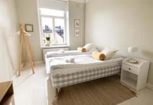 Postel nebo postele na pokoji v ubytování 2ndhomes Bright & Modern 1BR Home in Ullanlinna
