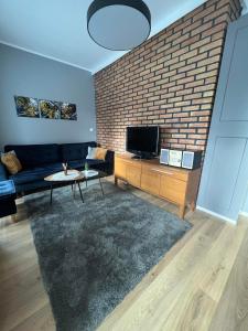 Telewizja i/lub zestaw kina domowego w obiekcie Chcę tu zostać Apartamenty Gdynia