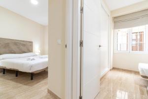 Łóżko lub łóżka w pokoju w obiekcie Allo Apartments Consistorio Centro 2 Habitaciones