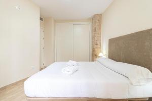 Łóżko lub łóżka w pokoju w obiekcie Allo Apartments Consistorio Centro 2 Habitaciones