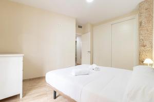 Łóżko lub łóżka w pokoju w obiekcie Allo Apartments Consistorio Centro 2 Habitaciones