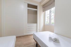 Łóżko lub łóżka w pokoju w obiekcie Allo Apartments Consistorio Centro 2 Habitaciones