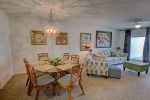 a living room with a table and a couch at El Matador 224 - Centrally located to all the amenities at El Matador in Fort Walton Beach
