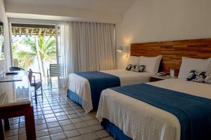 Ένα ή περισσότερα κρεβάτια σε δωμάτιο στο Hotel Portobello Resort & Safari