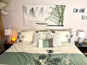 a bedroom with a bed with pillows on it at Gorgeous New Zen Suite Sleeps 4-Ski On Off Jiminy in Hancock