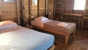 Letto o letti in una camera di Casa Cangrejo Fishing Lodge