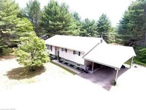 an aerial view of a white building with trees at Bancroft Petals I Sleep 9 l BBQ in Bancroft