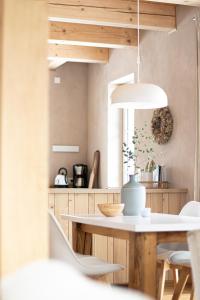 a dining room with a table and chairs in a kitchen at Holzmichel 