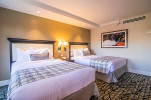 Postel nebo postele na pokoji v ubytování Hotel Lucerna Mexicali